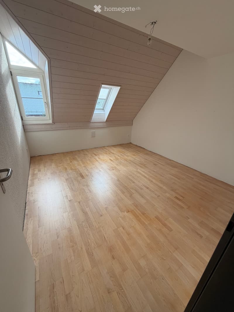 empty room, wooden floor, white walls, 2 attic windows