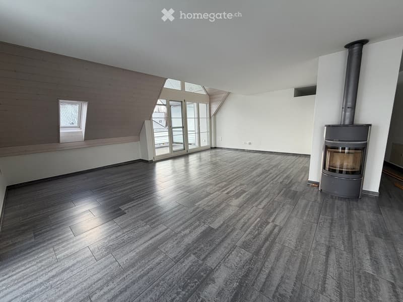 empty room with gray flooring, wooden ceiling, glass door, small window, fireplace