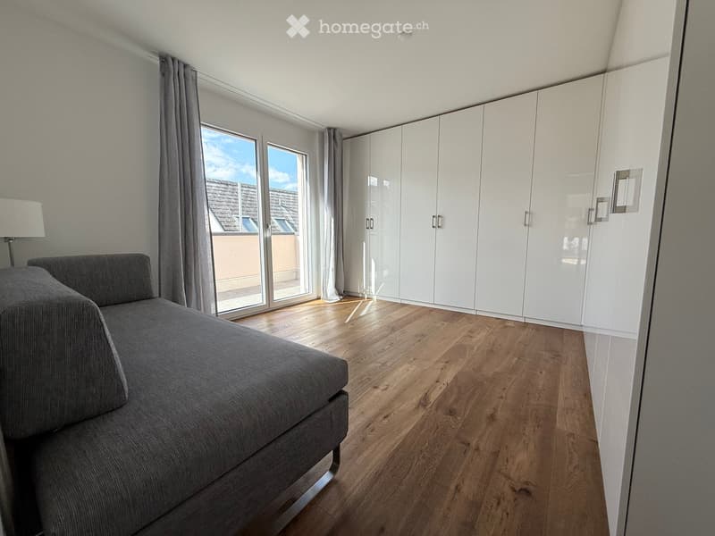 modern room with wooden floor, gray sofa, white wardrobe, large glass window, gray curtains, lamp