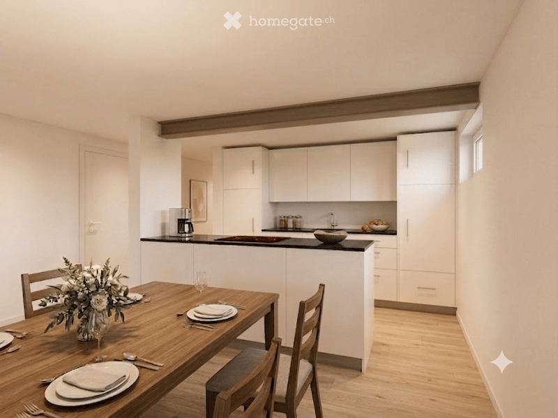 Modern kitchen with white cabinets, black countertop, and a wooden dining table set for two with plates, cutlery, and a vase of flowers.