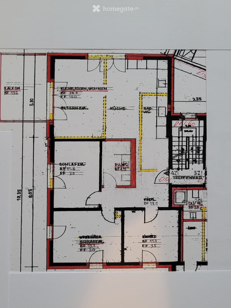 Floor plan showing a multi-room layout including a kitchen, living area, bedroom, bathroom, and staircase.