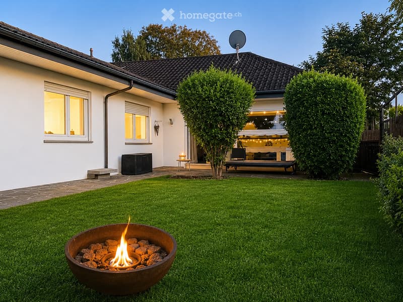 Well-maintained garden with a fire pit, neatly trimmed lawn, and a modern house with large windows and a covered patio area.