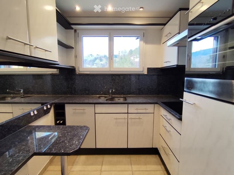 modern kitchen with granite countertops, white cabinets, black granite countertops, double sink, dishwasher, oven, window