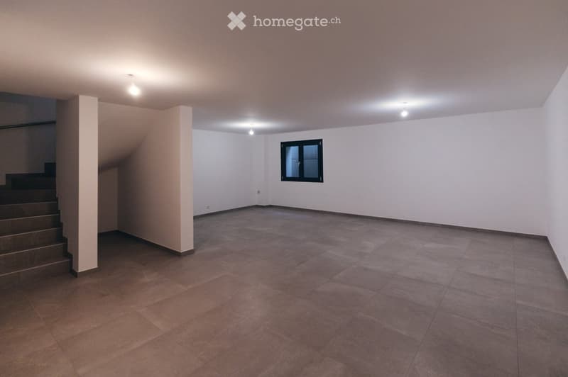 Empty room with tiled floor, white walls, and a window. No furniture or equipment present.