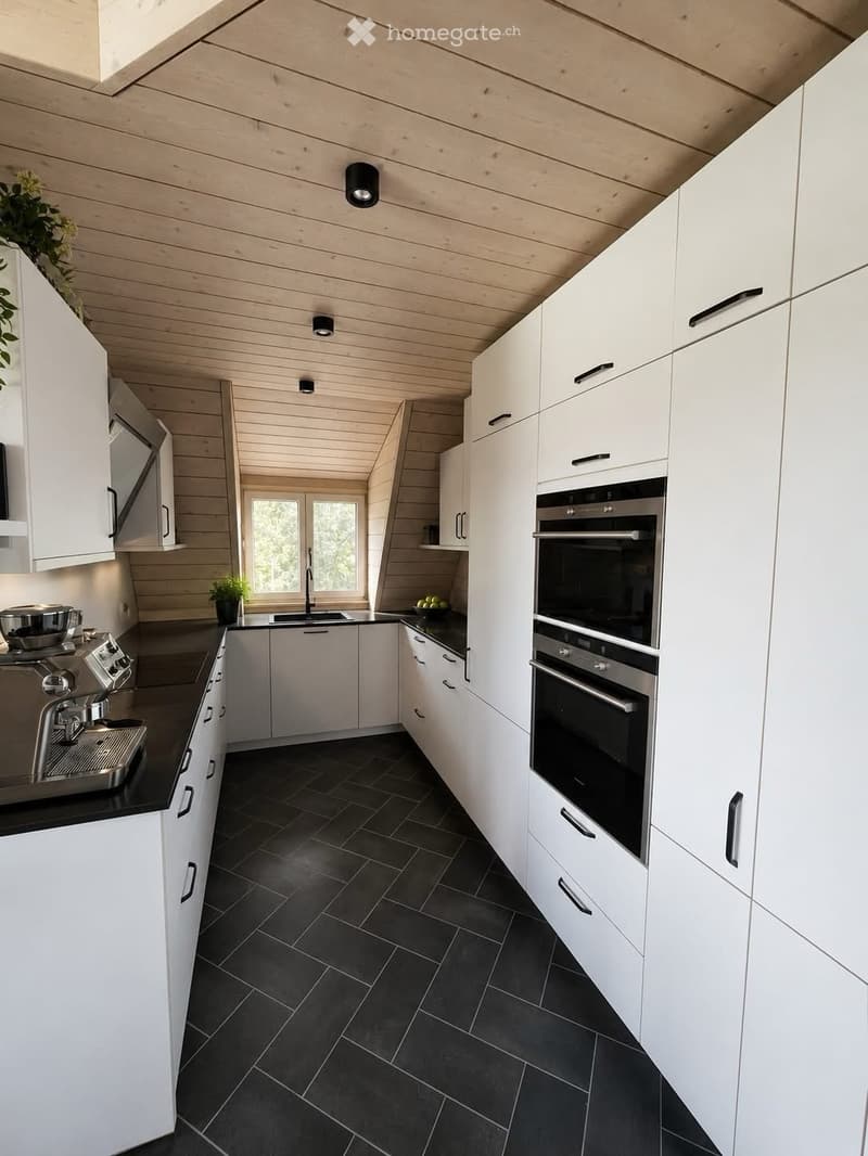 Modern kitchen with white cabinets, black tiled floor, stainless steel oven, and coffee machine on the counter.