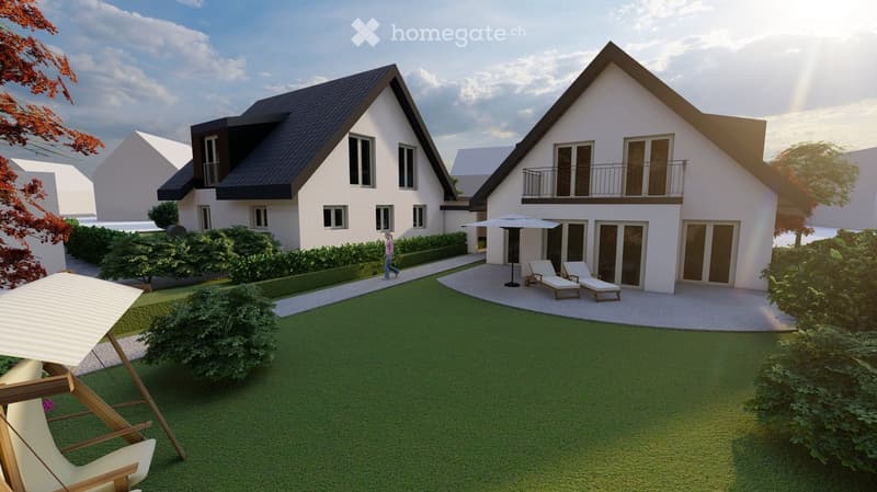 Modern two-story house with white exterior, dark roof, multiple windows, and a balcony on the upper floor. The house is surrounded by a well-maintained lawn, shrubs, and outdoor seating areas with lounge chairs and umbrellas.