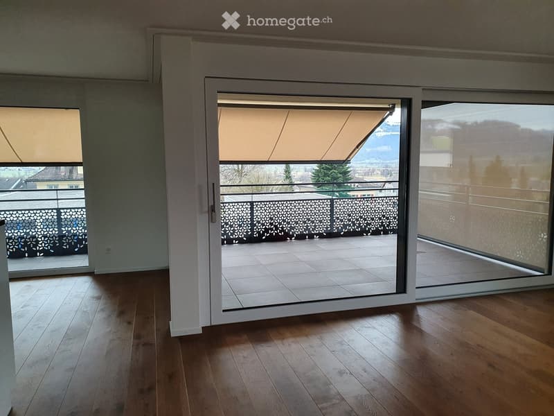 wooden floor, sliding glass doors, balcony, view of mountains