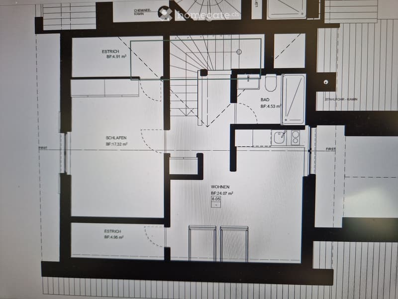 Floor plan of a residential unit with labeled rooms: living area, bedroom, bathroom, hallway, and storage spaces.