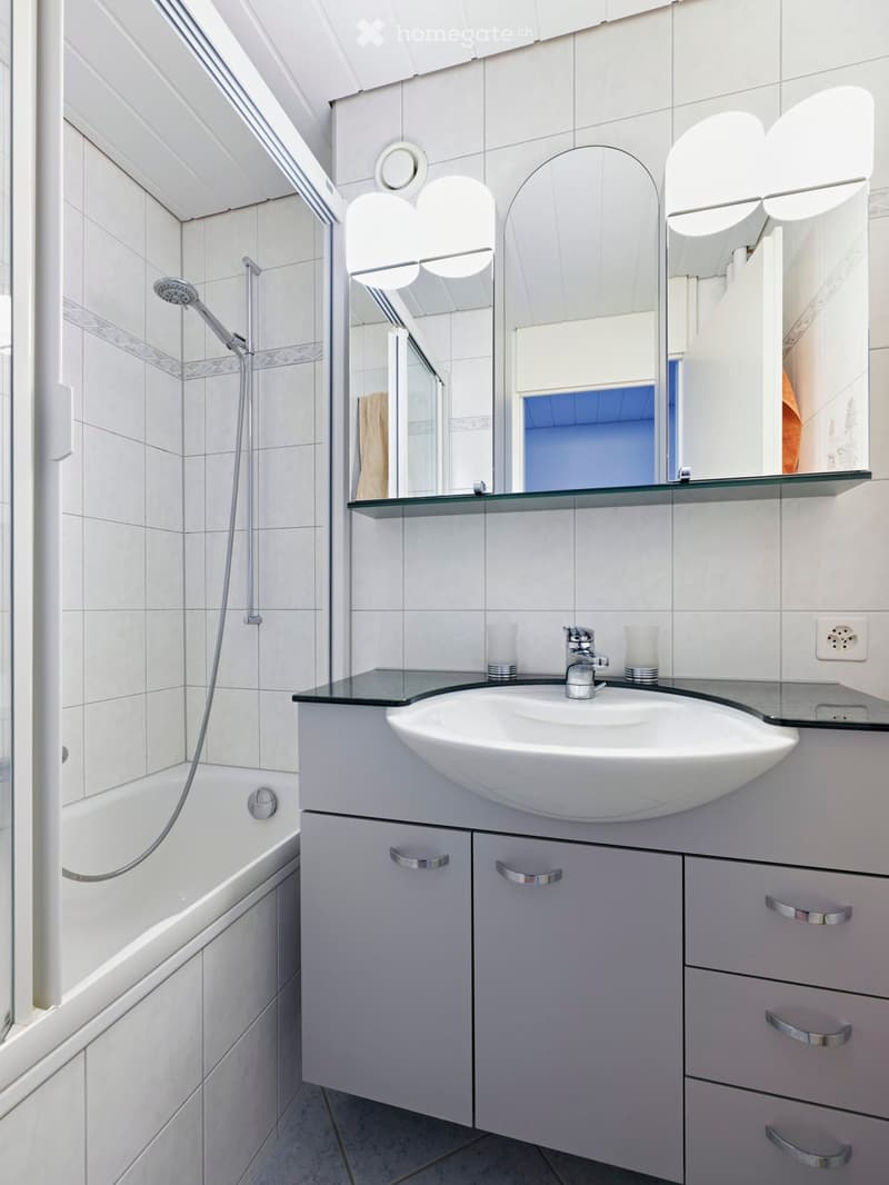 modern bathroom, white tiles, bathtub, shower, sink, mirror, cabinets, faucet, power outlet