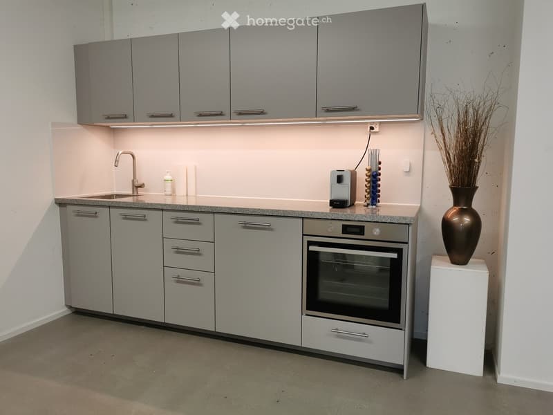 modern kitchen with granite countertop, gray cabinets, stainless steel sink, electric oven, dishwasher, and a faucet