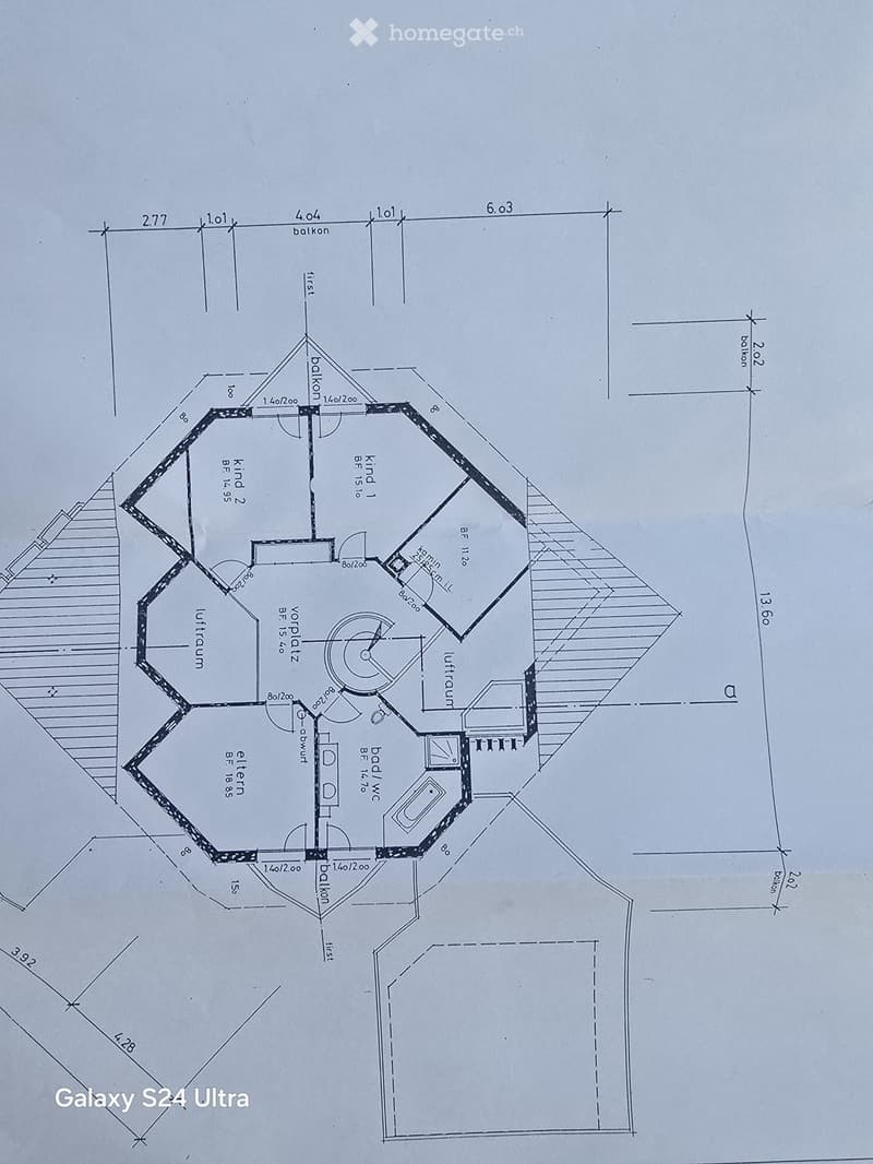 Floor plan of a multi-room layout including a living room, kitchen, bedrooms, and bathrooms, with labeled dimensions and room names.