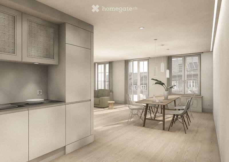 Open-plan living and dining area with modern furniture, including a sofa, dining table, chairs, and a small kitchen area with cabinets and a stove.