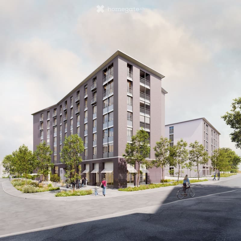 Modern multi-story residential building with balconies, surrounded by greenery and a paved walkway.
