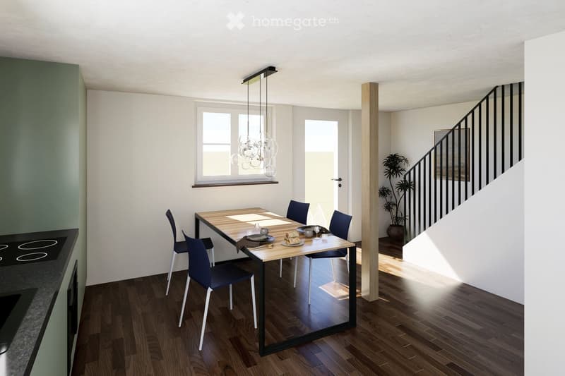 Modern dining area with a wooden table, four blue chairs, and a pendant light fixture above. The room features wooden flooring, white walls, and a staircase leading upwards.