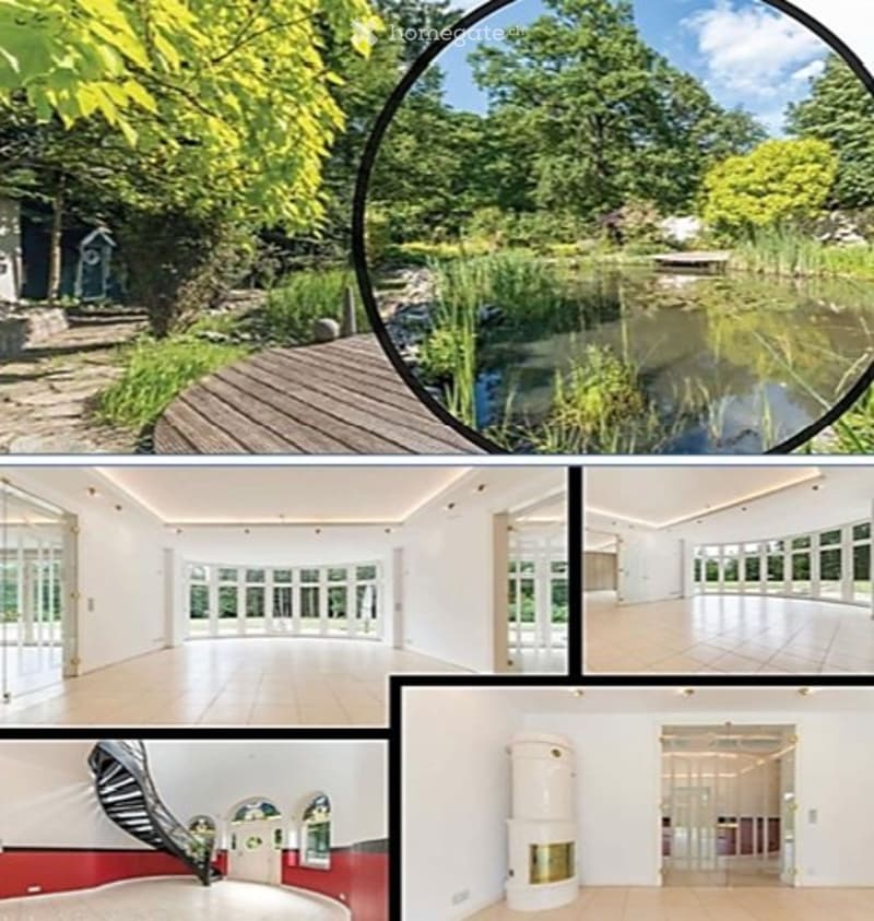 A modern house with large windows, wooden flooring, a spacious living area, a staircase, and a fireplace. The outdoor area features a pond, wooden decking, and lush greenery.