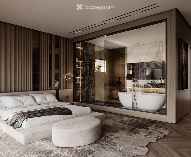 Modern bedroom with a large bed, ottoman, and a spacious, glass-enclosed bathroom featuring a freestanding bathtub.