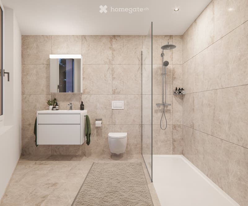 Modern bathroom with beige tiles, a white sink with a mirror, a toilet, a bathtub with a glass shower enclosure, and a towel hanging on the wall.