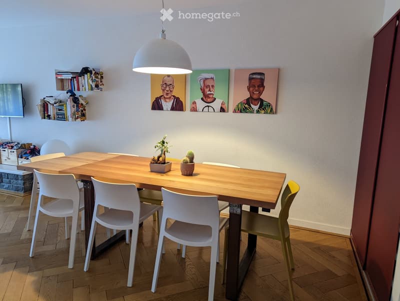 {"visible_features":[],"type":"Dining room","description":"Wooden dining table with white chairs, wooden floor, three paintings on the wall, potted plants on the table"}