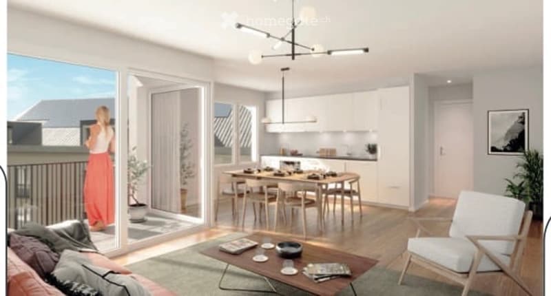 Modern open-plan living and dining area with large windows and balcony access. Features a sofa, coffee table, dining table with chairs, and a kitchen area with cabinets.