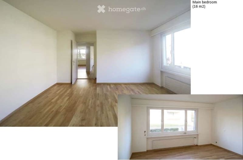 Empty bedroom with wooden flooring, white walls, and large windows. No furniture or equipment present.