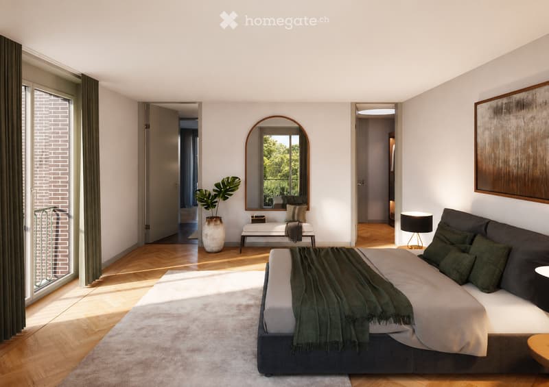 Modern bedroom with a large bed, nightstand, lamp, bench, vase with plant, mirror, and picture frame. The room features wooden flooring and large windows with a view of greenery.