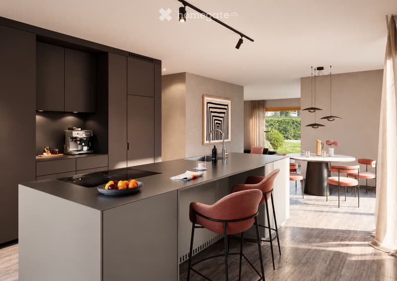 Modern kitchen with dark cabinets, a central island, and a dining area. Features include a coffee machine, sink with a modern faucet, bar stools, a round dining table with chairs, and a framed picture on the wall.