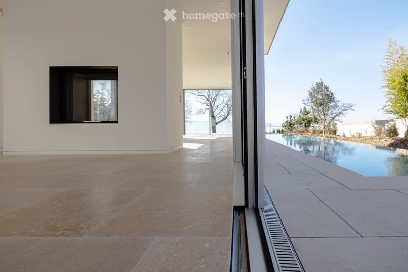 open space, large windows, tiled floor, view of swimming pool