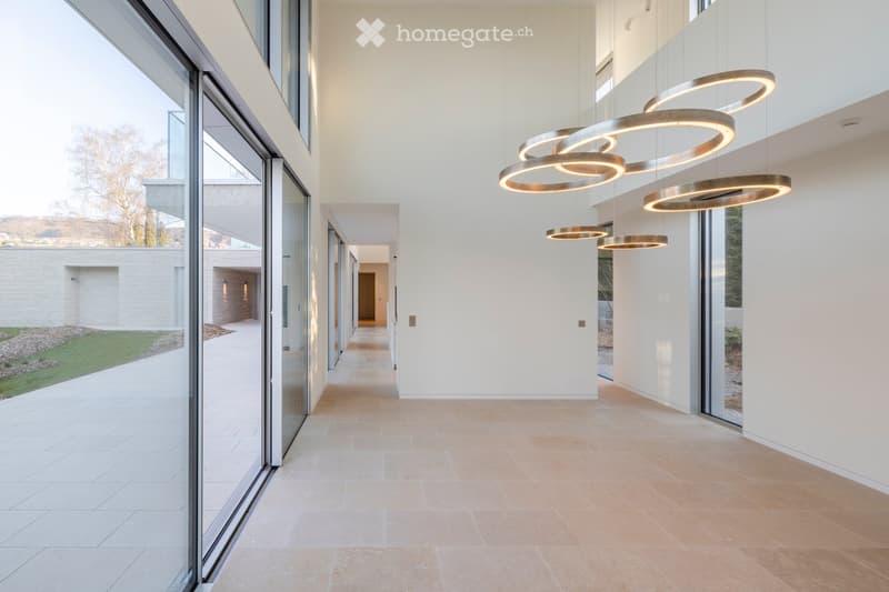 modern hallway with large glass doors, beige tiles, large windows, modern lighting