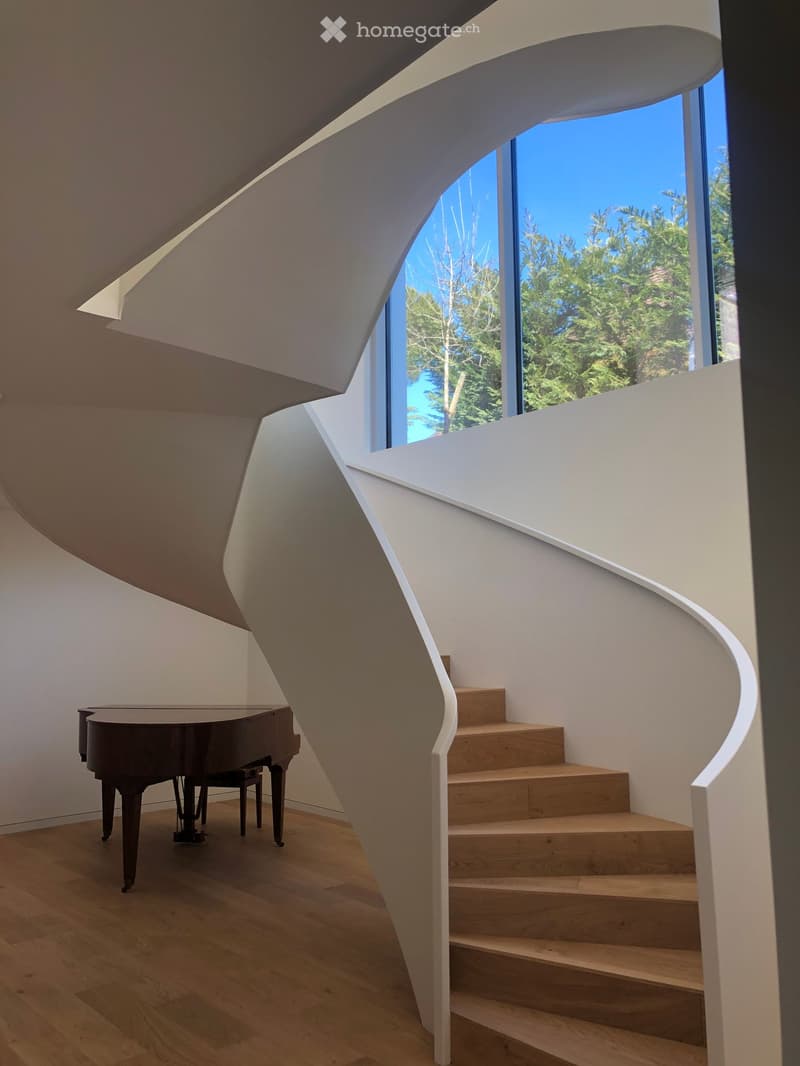 spiral staircase, wooden floor, grand piano, large window