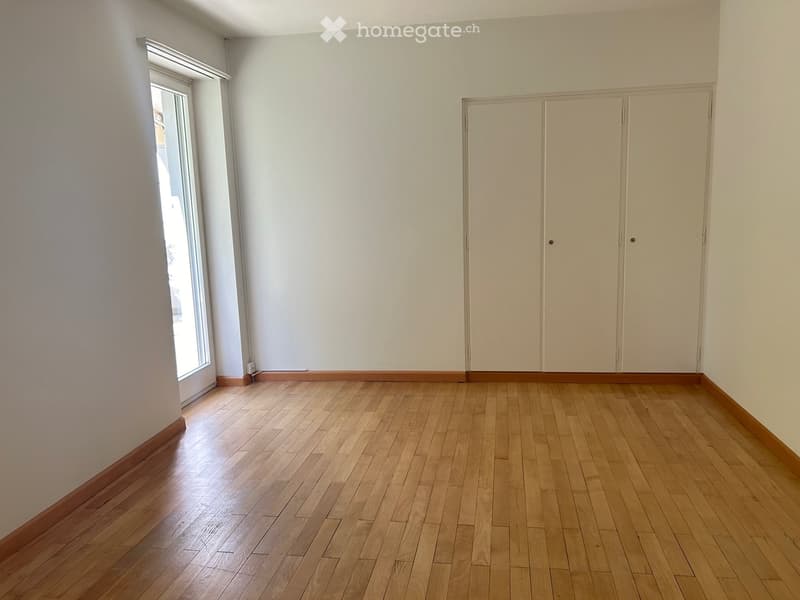 wood floor, white walls, double wardrobe, sliding glass door