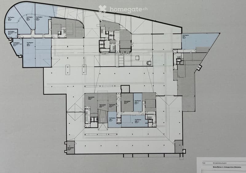 Floor plan of a multi-level commercial or mixed-use building, showing various rooms and spaces including offices, storage areas, and open spaces.