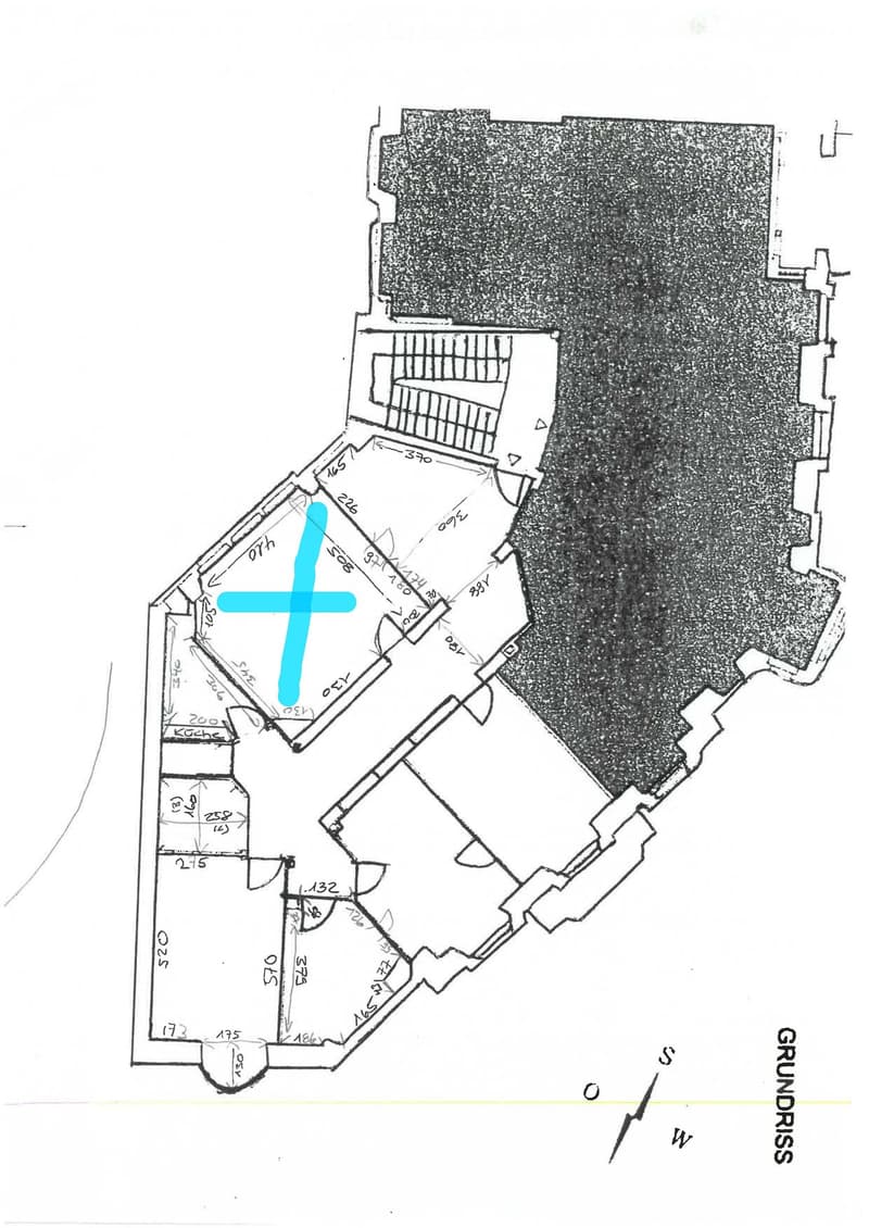 Main floor plan with multiple rooms, central staircase, and a highlighted area