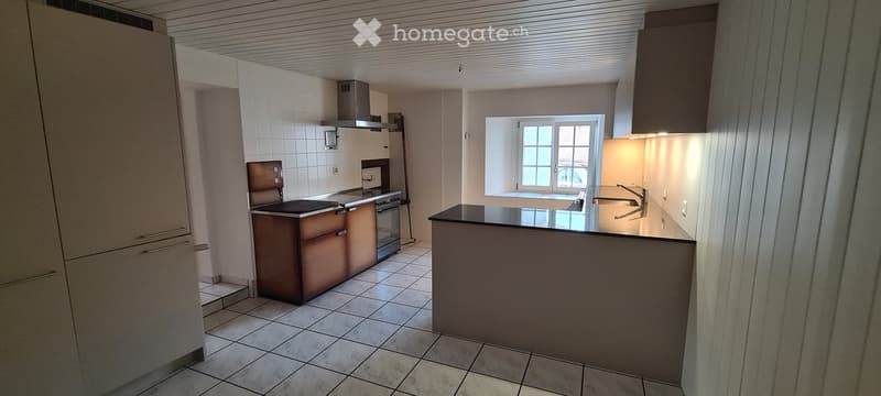 kitchen with white tiled floor, tiled countertop, wooden cabinet, window, sink, faucet, built-in appliances including stove and oven, kitchen extractor, power outlets