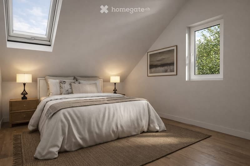 Cozy attic bedroom with wooden floors, large windows, a neatly made bed, bedside tables with lamps, and a framed picture on the wall.