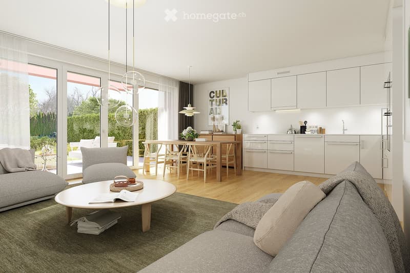 Modern living and dining area with a grey sofa, white coffee table, dining table with chairs, and a sleek kitchen area with white cabinets and a countertop.