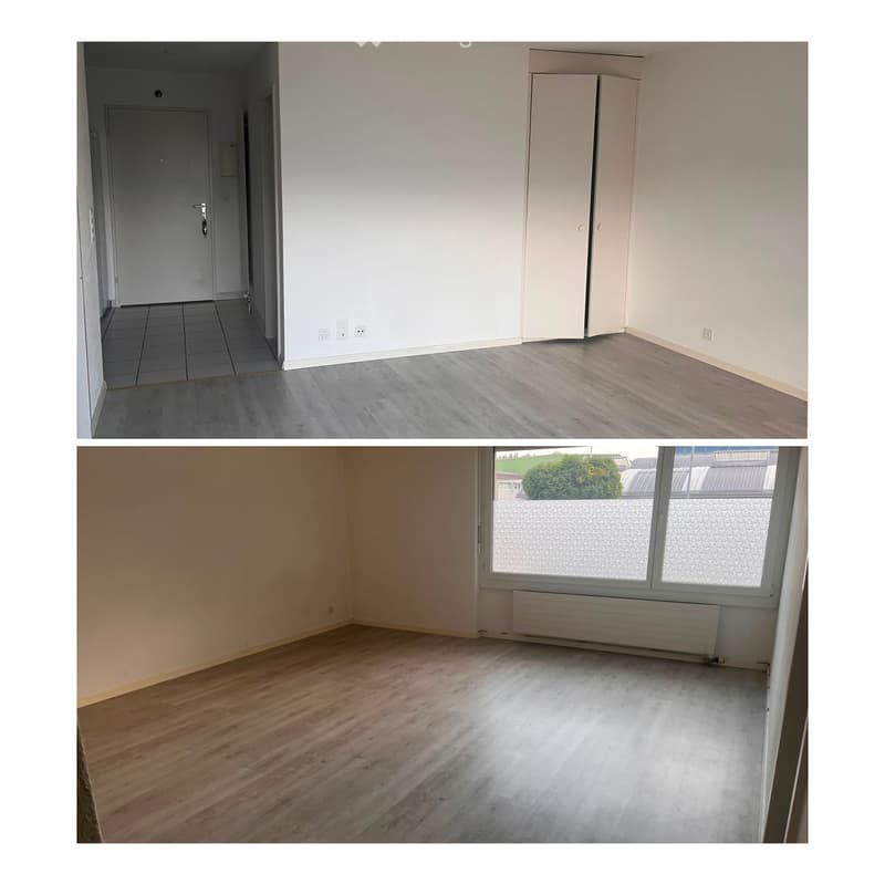Two unfurnished rooms with bare walls, wooden flooring, and minimal fixtures. The first room has tiled flooring and a closed door, while the second has large windows and a radiator.