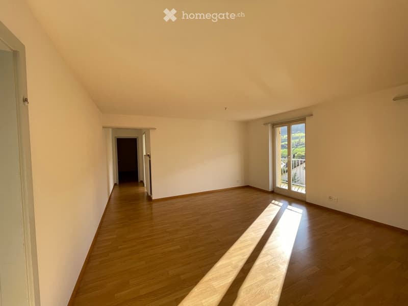 large room, wood floors, windows, balcony