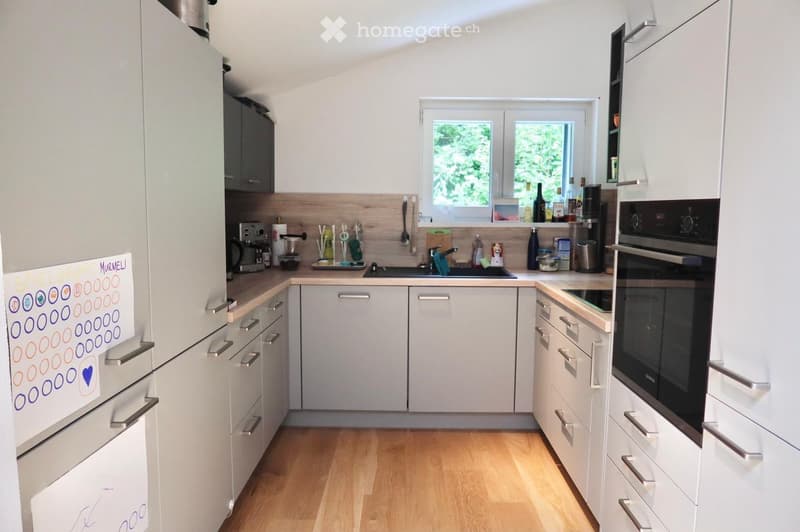 {"type": "Kitchen", "objects": ["refrigerator", "oven", "sink", "faucet", "coffee maker", "cupboard", "bottle", "fridge magnet", "cupboard", "bottle", "bottle", "bottle", "bottle", "bottle", "bottle", "bottle", "bottle", "bottle", "bottle", "bottle", "bot