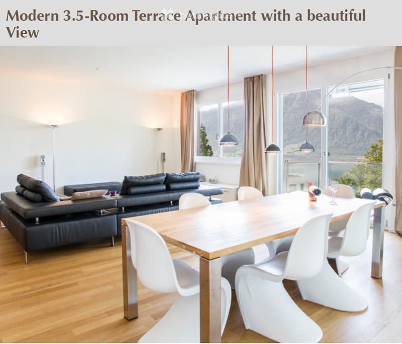 Modern living and dining area with a view, featuring a black leather sofa, wooden dining table, white chairs, and pendant lights.