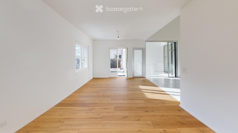 Empty room, white walls, wooden floor, glass doors, balcony