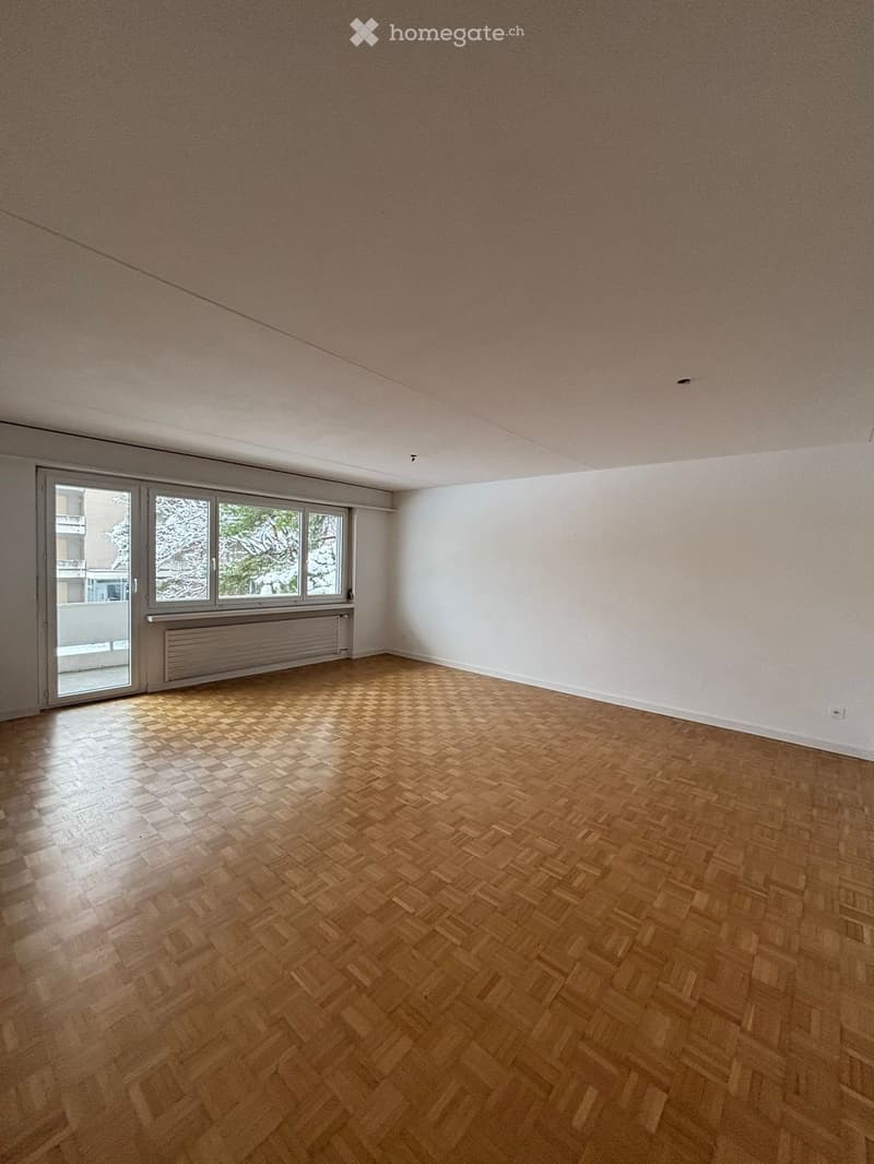 large windows with balcony, parquet floor, radiators