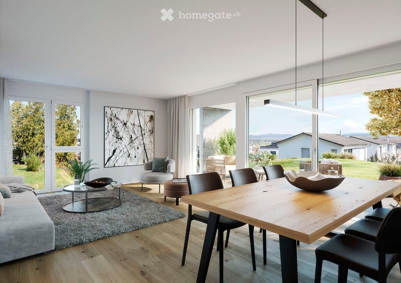 Modern living and dining area with large windows, a grey sofa, a coffee table, a dining table with chairs, and a decorative bowl on the table.
