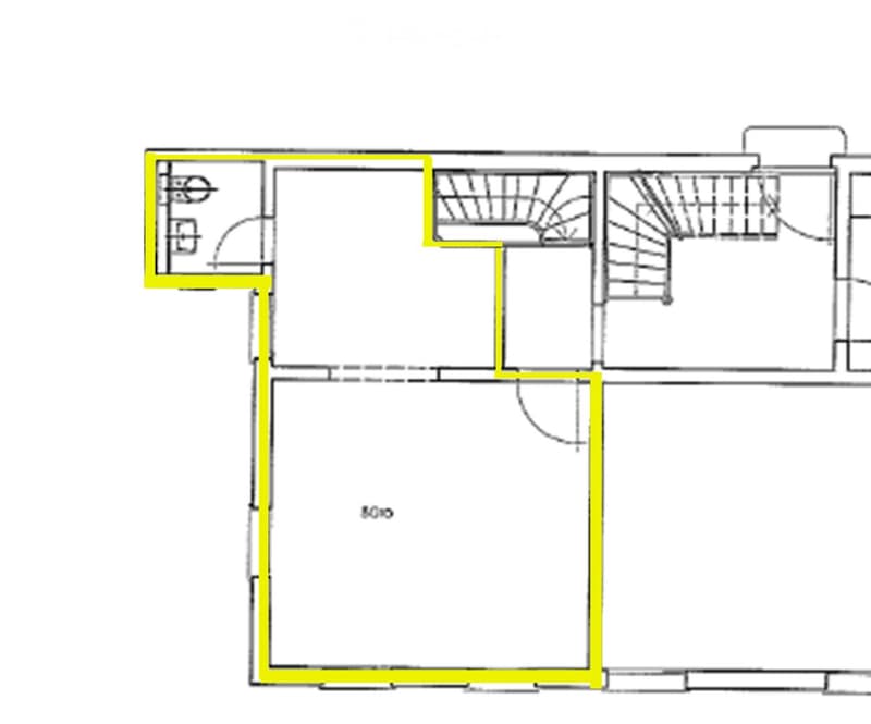 Floor plan of a residential space featuring a large living area, a kitchen, a bedroom, and a bathroom.