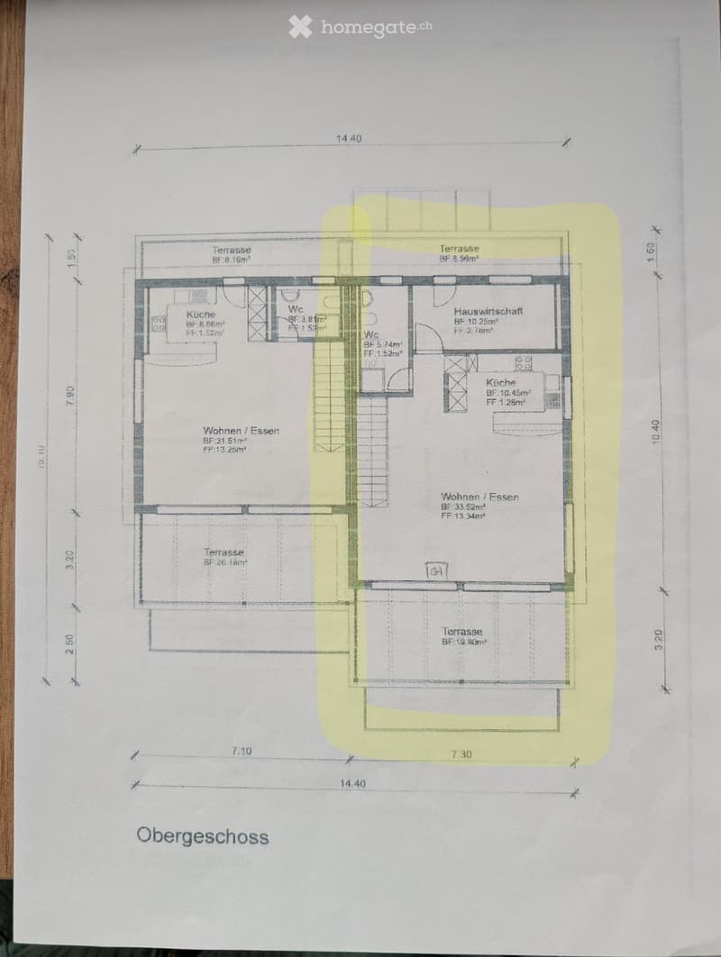 Floor plan of the upper floor showing living/dining area, kitchen, bathrooms, and terraces.