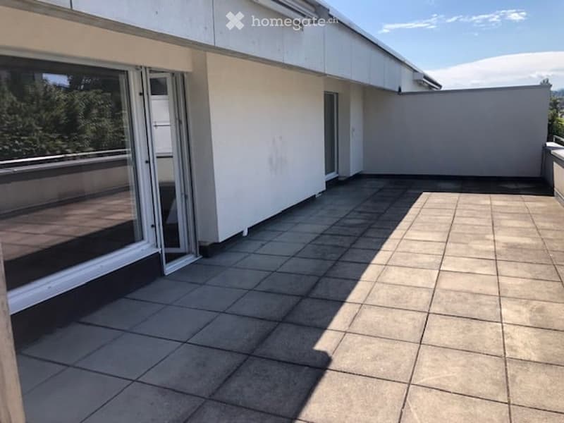 tiled floor, glass doors, white walls, railing, trees