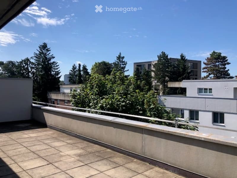 Outdoor terrace, tiled flooring, metal railing, view of nearby buildings and trees