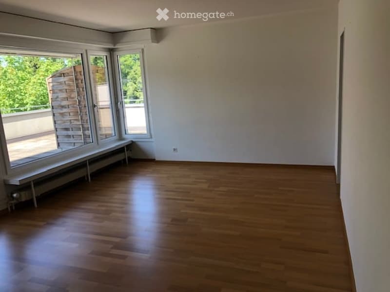 wooden floors, large windows, white walls, radiator