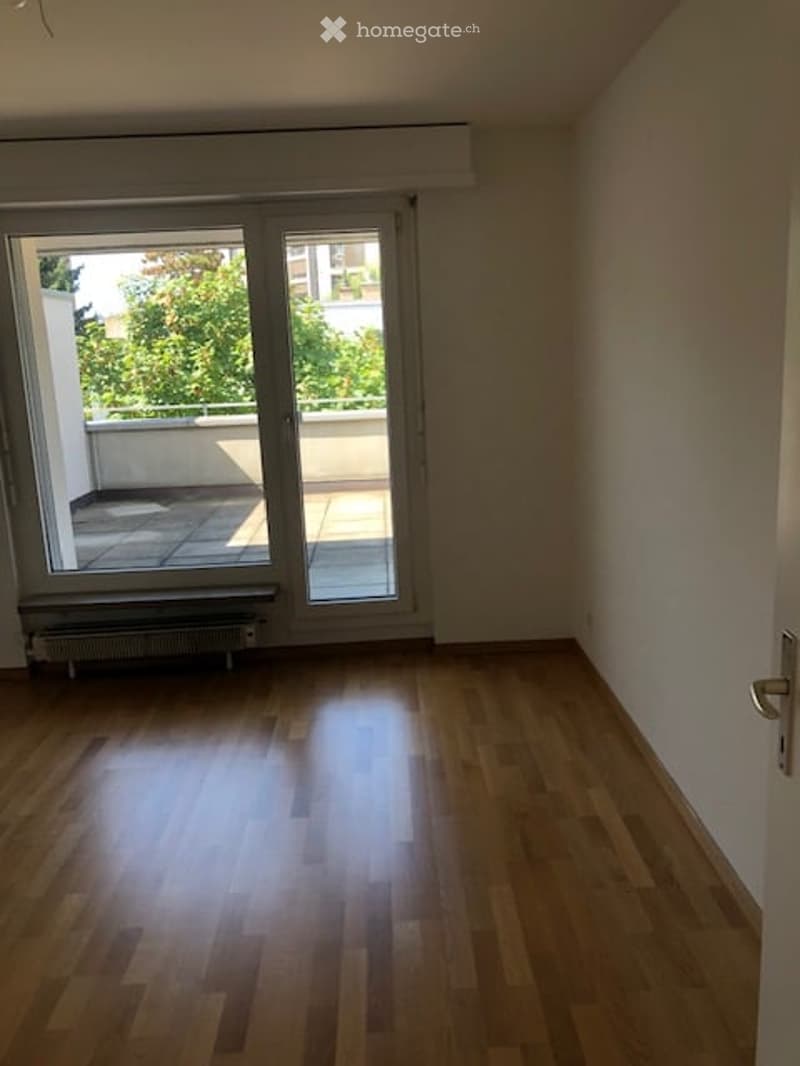 wooden floor, sliding glass doors, balcony, white walls