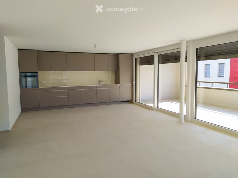 empty kitchen with double sliding doors leading to a balcony