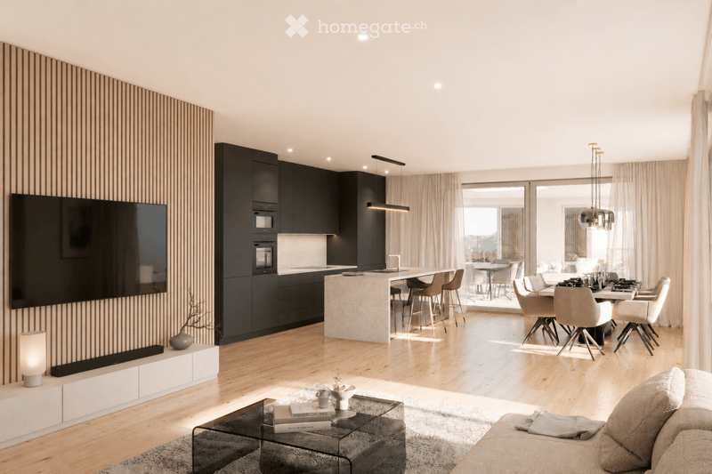 Modern open-plan living and dining area with a sleek kitchen, large island, comfortable sofa, coffee table, and dining table with chairs. The space features wooden flooring, large windows, and contemporary decor.